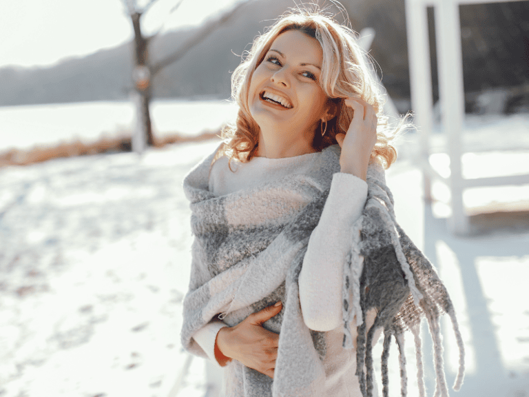lady protecting her skin in the winter with sunscreen