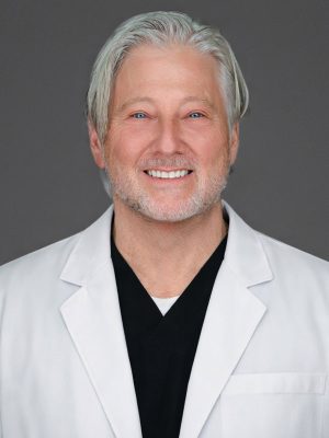 Dr. David Cohen in white coat