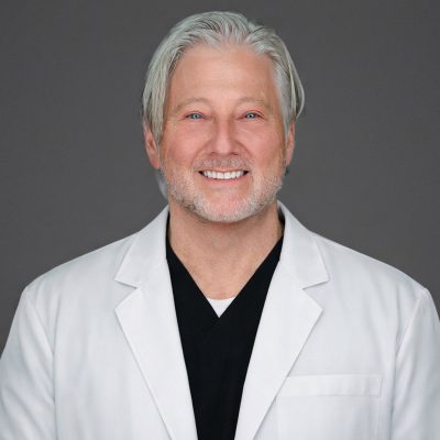 Dr. David Cohen in white coat
