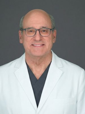 Dr. David Kent in white coat
