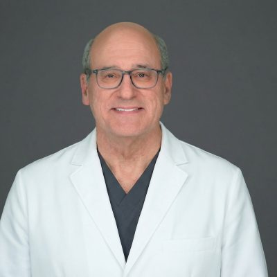 Dr. David Kent in white coat
