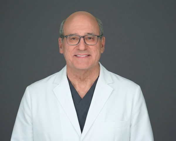 Dr. David Kent in white coat